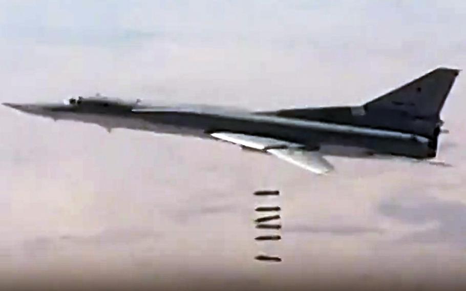 In this photo made from the footage taken from the Russian Defense Ministry official web site, a Russian long-range Tu-22M3 bomber strikes Islamic State targets in Syria, Sunday, Dec. 3, 2017. U.S. Defense Secretary Jim Mattis said Friday that U.S. forces will battle ISIS on one side of the Euphrates river, leaving Russian and Syrian government forces to handle the other side.