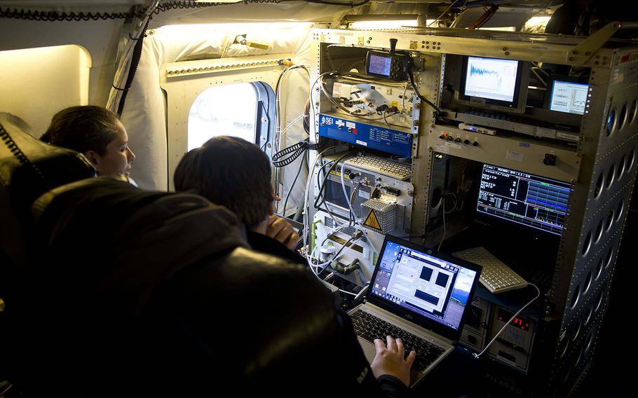 Research scientists check instrument displays during pre-flight checks on NASA's DC-8 Airborne Science Laboratory at Ramstein Air Base, Germany, on Wednesday, Jan. 24, 2018.

