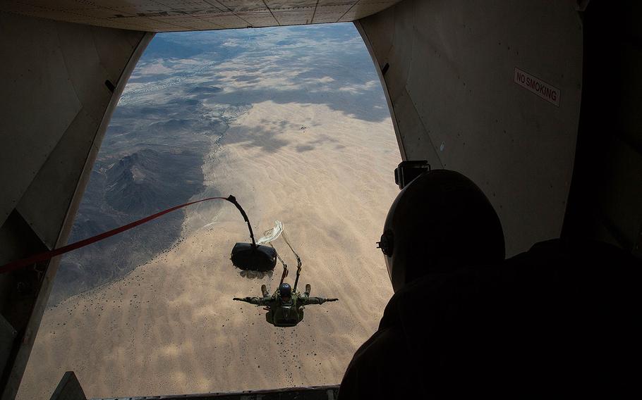 A Marine executes a double-bag static line jump during a parachute training course on Aug 26, 2014 in rural Arizona.
