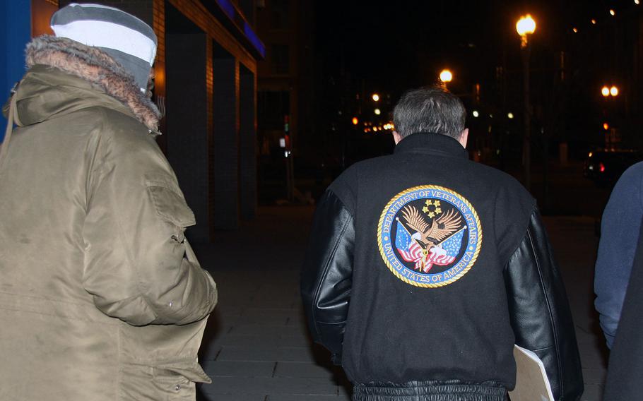 Department of Veterans Affairs Secretary David Shulkin, right, follows a man to his friend, whom he said was a veteran living outside near Union Station in Washington, D.C. Shulkin participated in the annual point-in-time count of the country's homeless on Wednesday, Jan. 25, 2018.