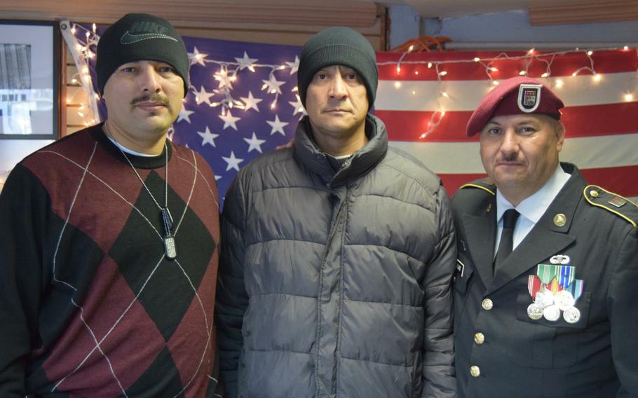Honorably discharged Marine Marco Chavez, center, stands with Hector Barajas, right, and another veteran on Dec. 21, 2017.
