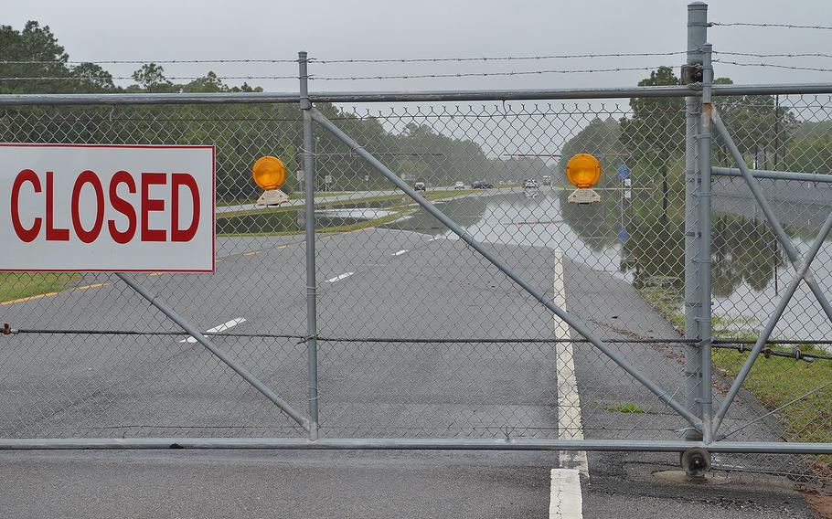 The west gate to Naval Air Station Pensacola is closed due to flooding from a storm starting April 29, 2014. Many areas of the base were inaccessible with water measured in excess of 3.5 feet in low lying areas.