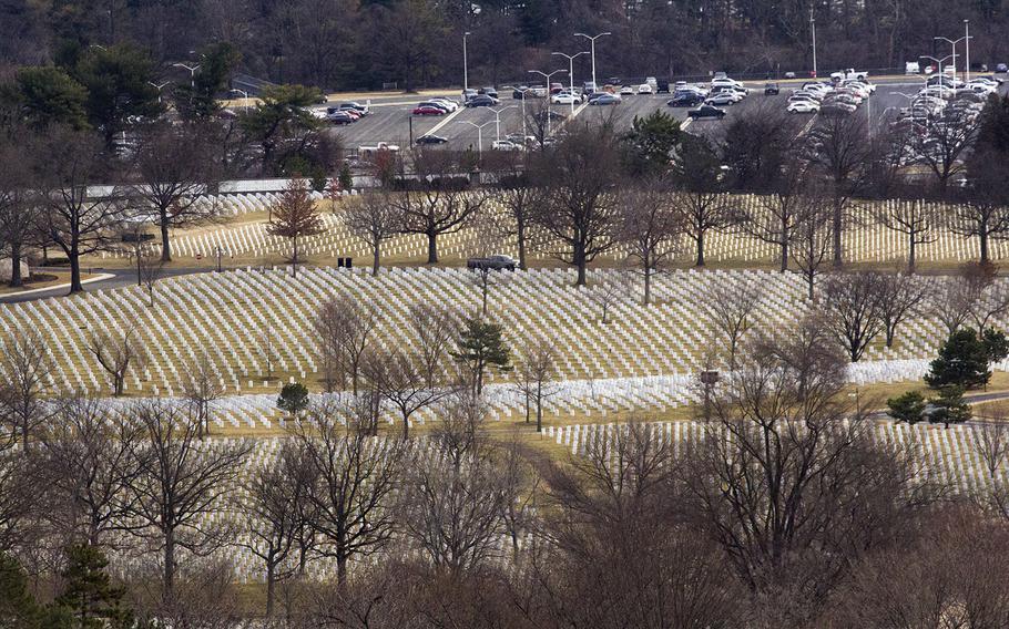 Graves at Arlington National Cemetery, with a Pentagon parking lot in the background, on Jan. 30, 2018.
