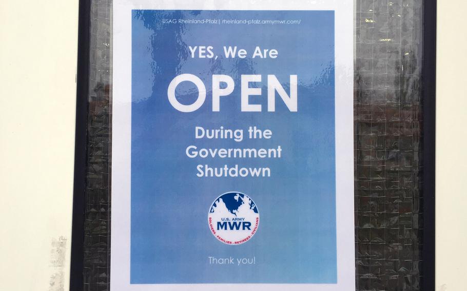 A sign shows an office at Kleber Kaserne in Kaiserslautern, Germany, was open on Friday, Feb. 9, 2018, during the government shutdown.