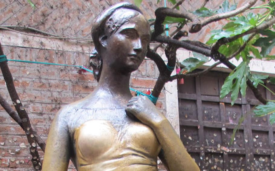 A bronze statue of Shakespeare's Juliet in the courtyard of the Cappelletti house in Verona, Italy, stands alone in a rare unmolested moment.

