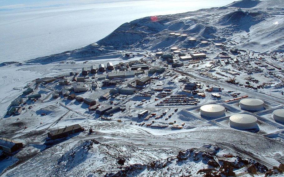 The National Science Foundation’s McMurdo Station, as seen from the summit of Observation Hill, Antarctica. The station was established in December 1955 and is the logistics hub of the U.S. Antarctic Program, with a harbor, landing strips on sea ice and shelf ice, and a helicopter pad.