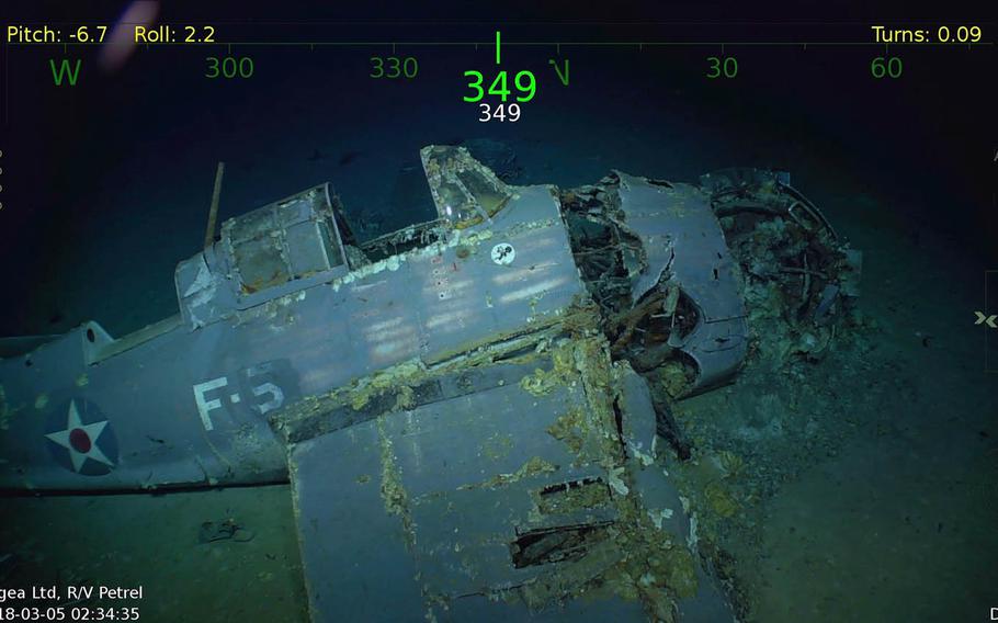 An intact fighter plane is still emblazoned with U.S. star emblems at the wreckage of the USS Lexington in the Coral Sea. 