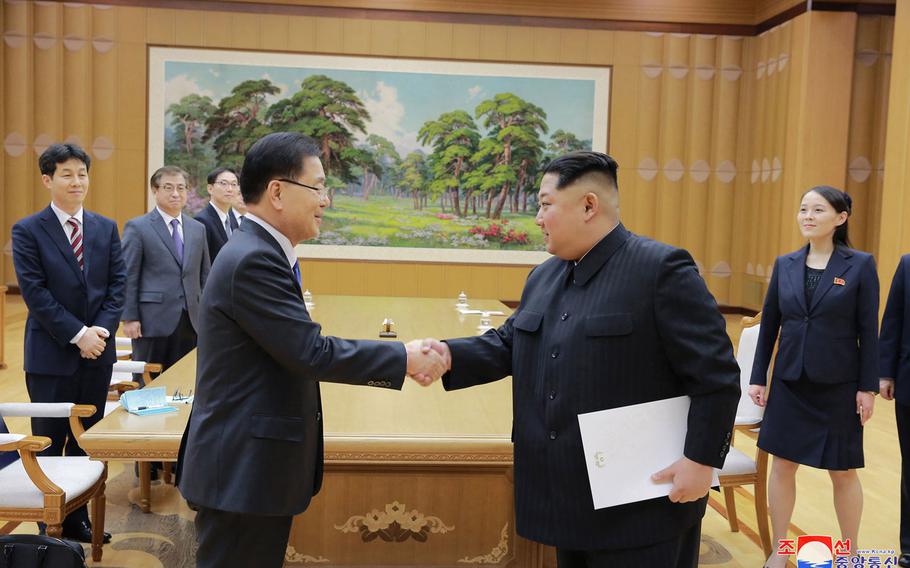 North Korean leader Kim Jong Un, front right, shakes hands with South Korean National Security Director Chung Eui-yong on Monday, March 5, 2018.