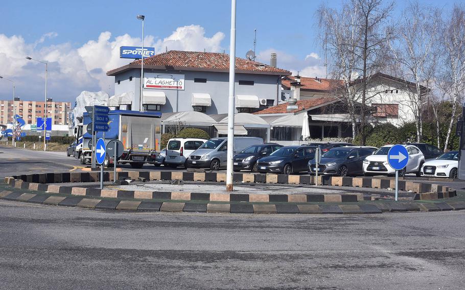 Little evidence is left at the traffic circle on the SS-13 (Via Aquileia) where a U.S. servicemember reportedly lost control of his vehicle in the early morning hours of Feb. 28, 2018, and struck four cars parked in the lot that serves the Al Laghetto bar and restaurant in Pordenone, Italy.