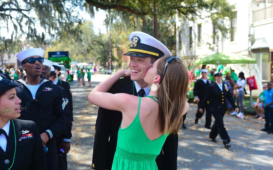 A member of the parade audience kisses Lt. Chris Peters during the city's annual St. Patrick's Day parade on March 15, 2017.  Peters and other USS McFaul (DDG 74) sailors participated in the parade as part of the ship's visit to the city. 