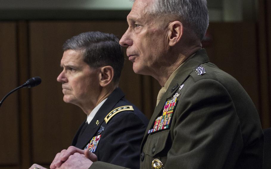 Gen. Joseph L. Votel, commander of the U.S. Central Command, left, and Gen. Thomas D. Waldhauser, commander of the U.S. Africa Command listen during a Senate Armed Services Committee hearing on Capitol Hill, March 13, 2018.
