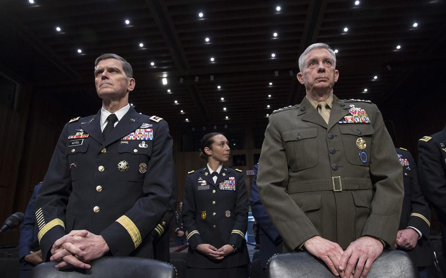 Gen. Joseph L. Votel, left, commander of the U.S. Central Command, left, and Gen. Thomas D. Waldhauser, commander of the U.S. Africa Command, await the start of a Senate Armed Services Committee hearing on Capitol Hill, March 13, 2018.