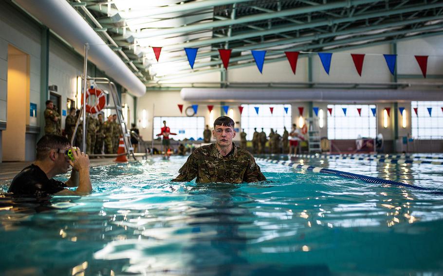 Pfc. Michael Jagelski, 94th Military Police Battalion, 19th Expeditionary Sustainment Command best warrior competitor comes up for a breath of air during a water survival event at Camp Walker, South Korea on Monday, March 5, 2018. 