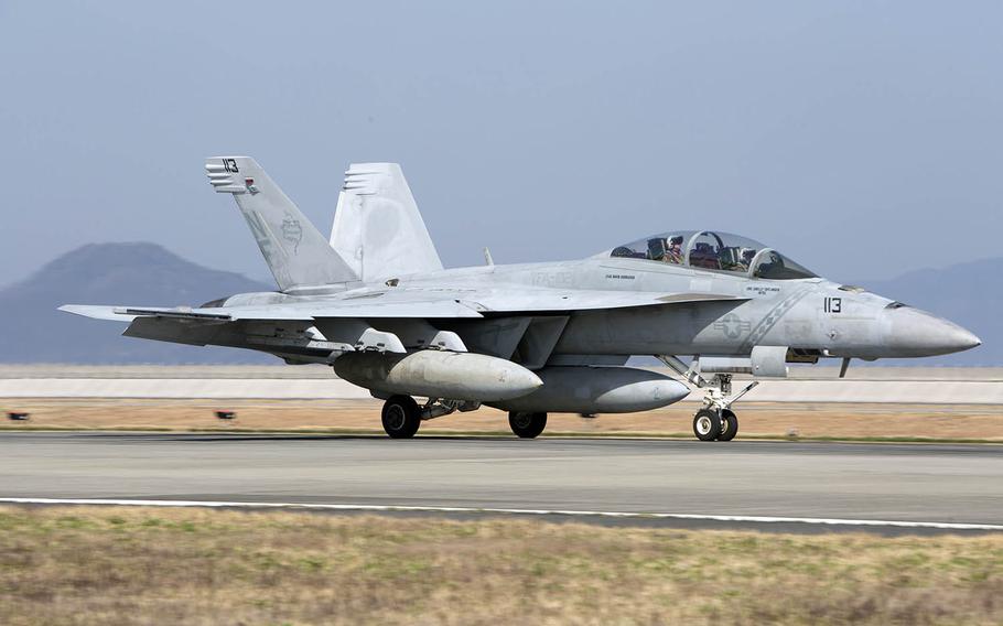 A Navy F/A-18F Super Hornet with Strike Fighter Squadron 102 arrives at Marine Corps Air Station Iwakuni, Japan, Wednesday, March 28, 2018.