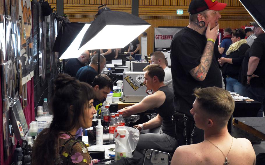 U.S. soldiers getting tattooed at the Tattoo Expo Grafenwoehr, in Grafenwoehr, Germany, Sunday, April 15, 2018.