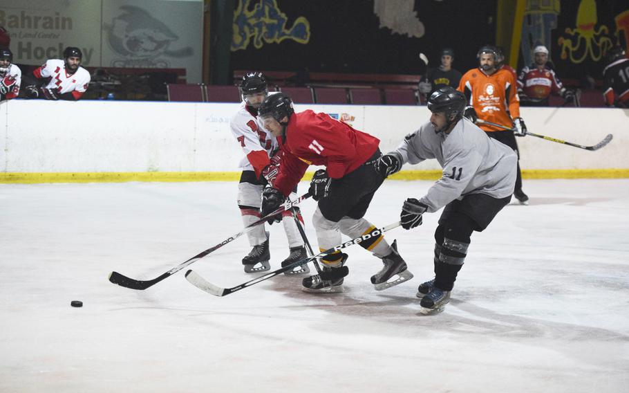 Hockey action at the Funland Centre in Manama, Bahrain, April 10, 2018. Bahraini locals, servicemembers and others meet twice a week for practice and games.

