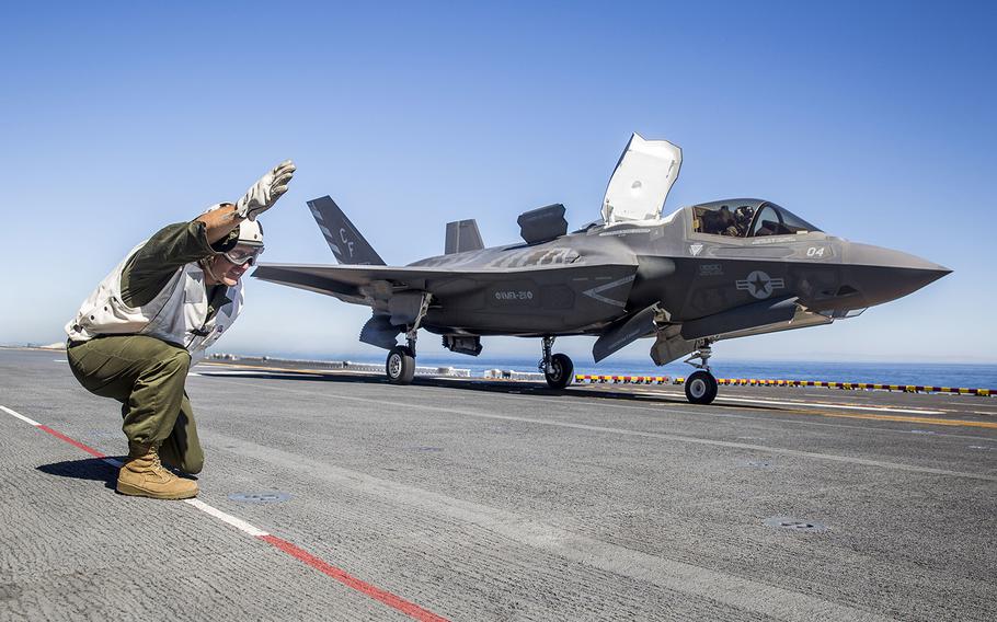 U.S. Marine Sgt. Maj. Allen Goodyear, the squadron sergeant major for Marine Fighter Attack Squadron (VMFA) 211, Marine Aircraft Group 13, 3rd Marine Aircraft Wing, signals for an F-35B Lightning II to launch from the flight deck of the USS Essexduring Exercise Dawn Blitz, Oct. 24, 2017. 