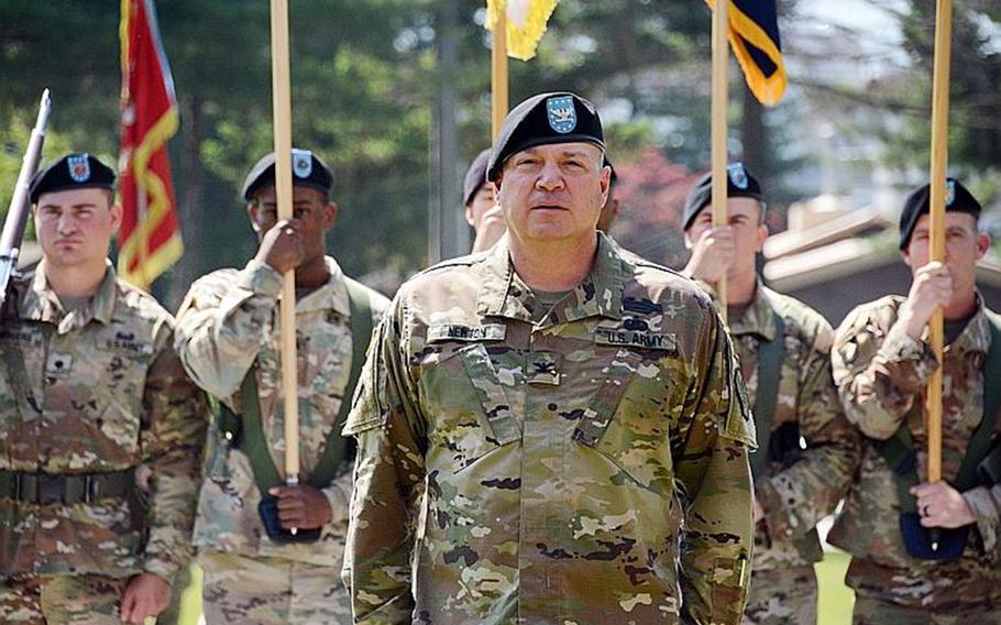 Col. Brandon Newton, garrison commander of Camp Red Cloud and other bases north of Seoul, South Korea, stands in front of a color guard during the garrison's inactivation ceremony, Thursday, June 21, 2018.
