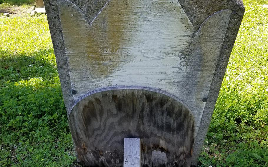 Some of the 19th century headstones at the Mare Island Naval Cemetery in Vallejo, Calif., are falling and being held up by logs. 