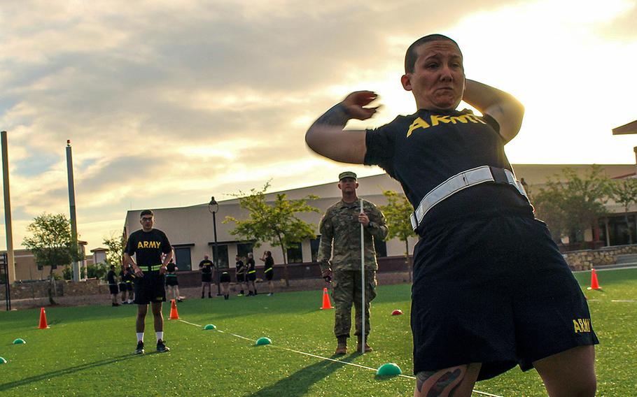 Spc. Shelbi Constancio, assigned to Headquarters Company, 150th Engineer Battalion, completes a backwards power throw during a pilot program for the Army Combat Fitness Test at Fort Bliss, Texas, April 17, 2018.