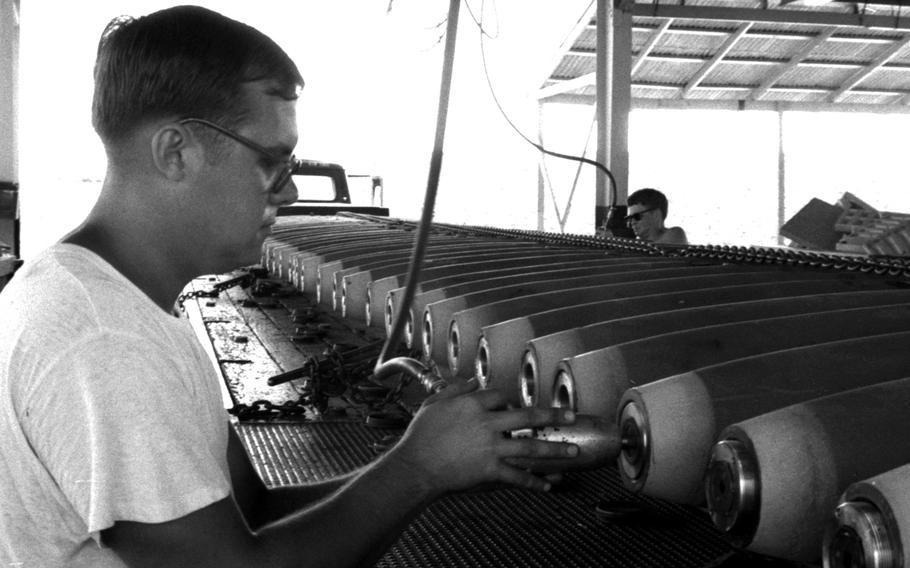 An airman prepares bombs for a B-52 mission at U-Tapao Royal Thai Navy Airfield, Thailand, in January, 1970.