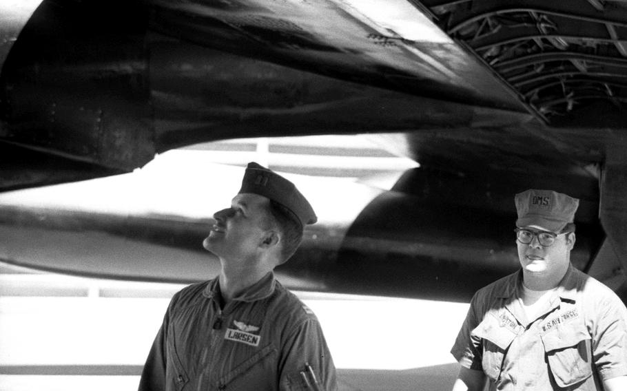Capt. Ronald E. Larsen, left, the aircraft commander, checks out his B-52 before a mission in January, 1970.