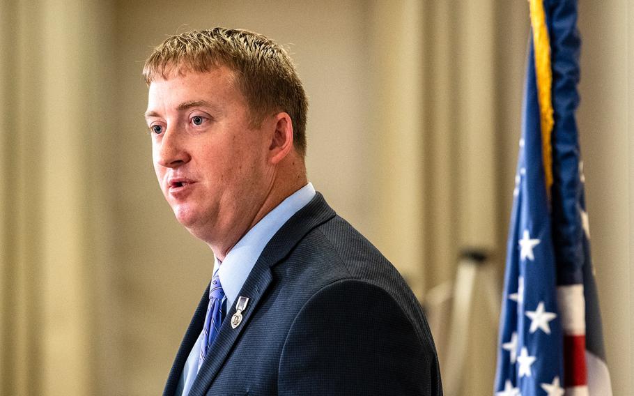 Army National Guard Maj. Zachariah Fike speaks during the 2018 "Eight on Seven" event in Washington D.C. on Purple Heart Day observed each year on Aug. 7, the anniversary of the creation of the medal by George Washington. Fike, founder of Purple Hearts Reunited, presided over Tuesday's ceremony in which eight Purple Heart Medals were returned to recipients or families of recipients.