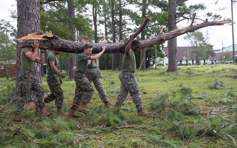 Marines with Marine Corps Air Station New River conduct a clean up effort after Hurricane Florence at McCutcheon Manor on MCAS New River, N.C., Sept. 17, 2018.