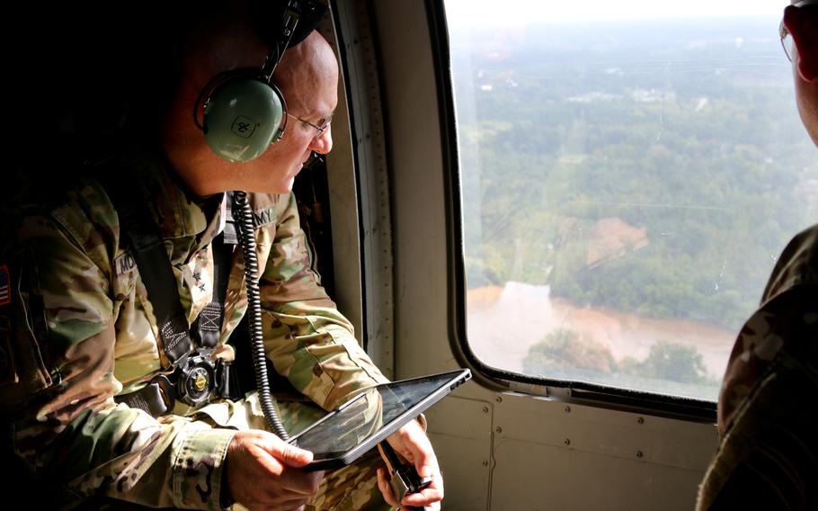 U.S. Army Maj. Gen. Brian McKiernan, the deputy commanding general of the XVIII Airborne Corps., assesses the impact of Hurricane Florence on the Fayetteville, North Carolina, community from a UH-60 Black Hawk helicopter, Sep. 17, 2018. 