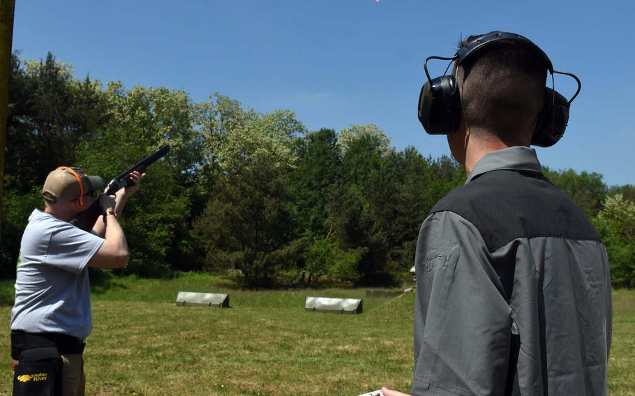 Brandon Cowell, the hunting coordinator for KMC Outdoorsmen, aims his shotgun at a flying clay at one of the ranges at the Kaiserslautern Rod and Gun Club in Kaiserslautern, Germany.

