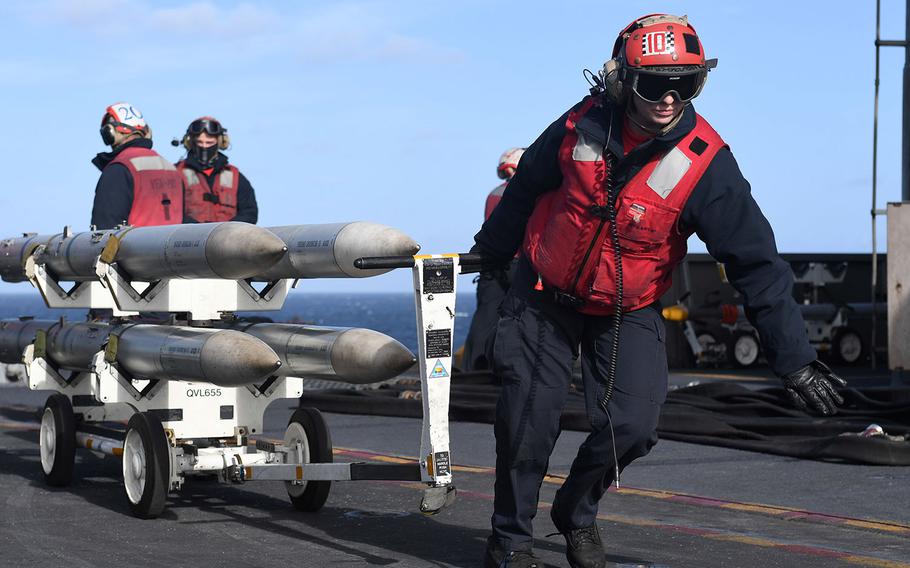 Aviation Ordnanceman Airman Rachel Foley, assigned to the “Red Rippers” of Strike Fighter Squadron (VFA) 11, transports ordnance on the flight deck aboard the Nimitz-class aircraft carrier USS Harry S. Truman (CVN 75) while in the North Sea on Sept. 30, 2018. 