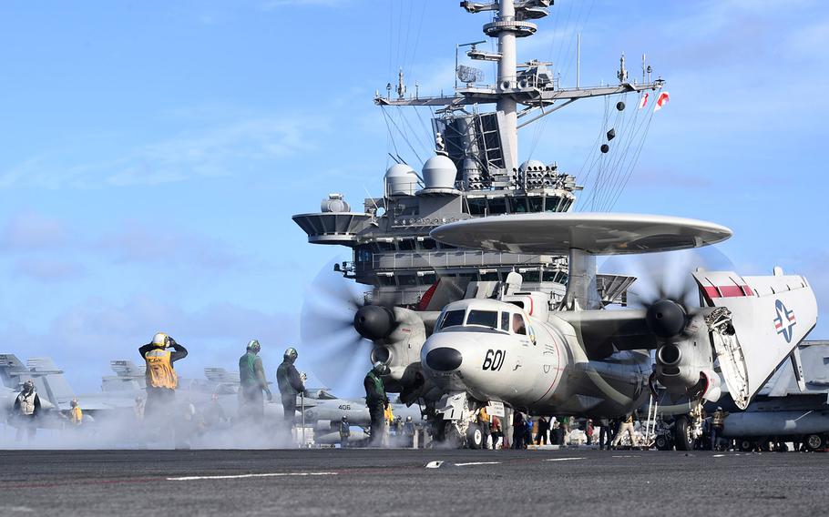 An E-2D Hawkeye, assigned to the "Seahawks" of Carrier Airborne Early Warning Squadron (VAW) 126, prepares to launch off the flight deck aboard the Nimitz-class aircraft carrier USS Harry S. Truman  on Sept. 30, 2018 as the strike group operates in the North Sea.