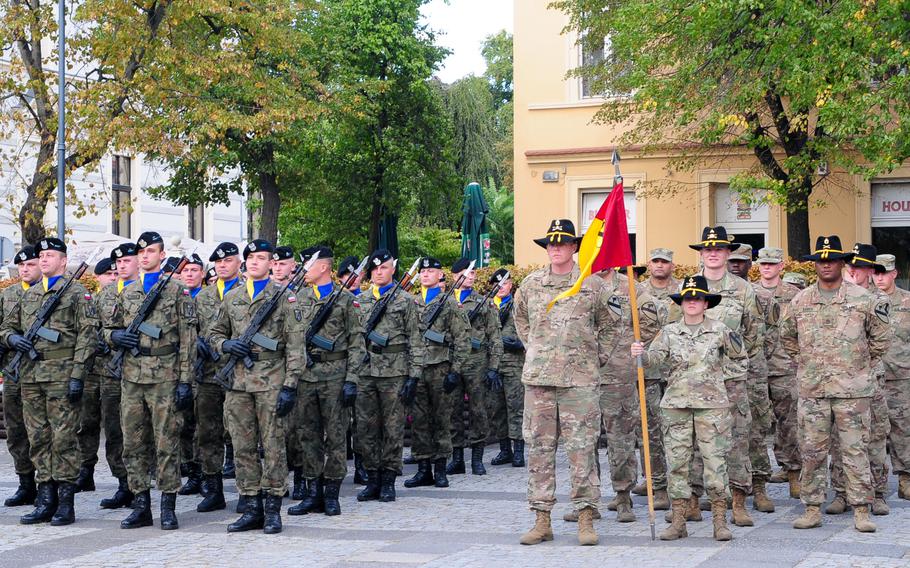 Soldiers assigned to Headquarters and Headquarters Company, 1st Armored Brigade Combat Team, 1st Cavalry Division, stand in formation alongside the Polish 11th "Lubuska" Armored Cavalry Division soldiers during a ceremony to observe the Black Division Day in Zielona Gora, Poland, Sept. 21, 2018. 

