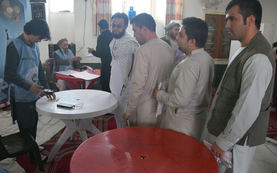 Afghans prevented from voting on Election Day because of technical and organizational problems at their polling center in Kabul vote a day later on Sunday, Oct. 21, 2018.