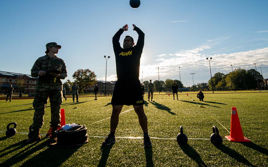 A soldier with the 128th Aviation Brigade at Fort Eustis, Va., attempts the standing power throw during a demonstration Tuesday, Oct. 23, 2018, of the Army's new six-event Army Combat Fitness Test.