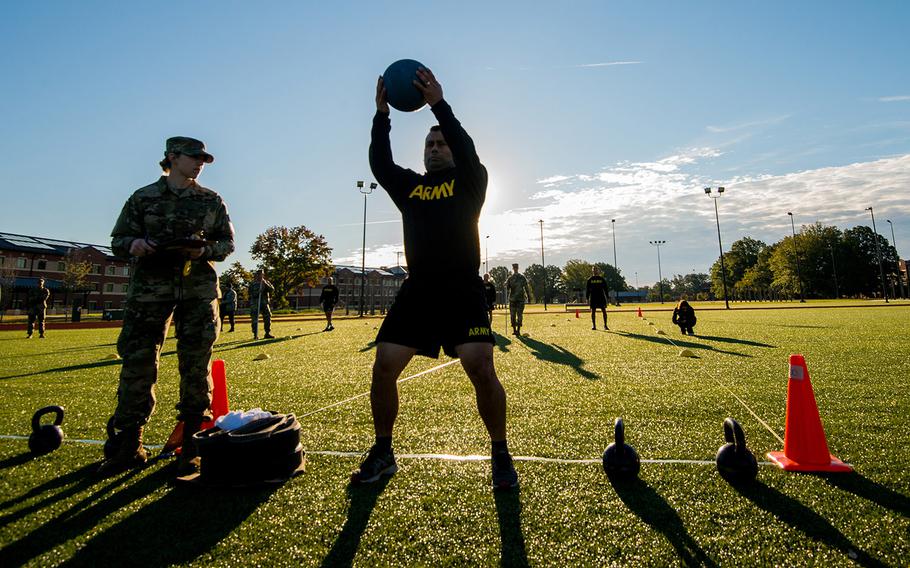 A soldier with the 128th Aviation Brigade at Fort Eustis, Va., attempts the standing power throw during a demonstration Tuesday, Oct. 23, 2018, of the Army's new six-event Army Combat Fitness Test.
