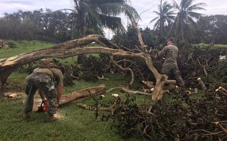U.S. Marines and Navy Seabees clear debris from Typhoon Mangkhut on Tinian, Northern Marianas Islands, Sept. 11, 2018. Another storm hit the U.S. Commonwealth of the Northern Mariana Islands on Thursday, Oct. 25, 2018.