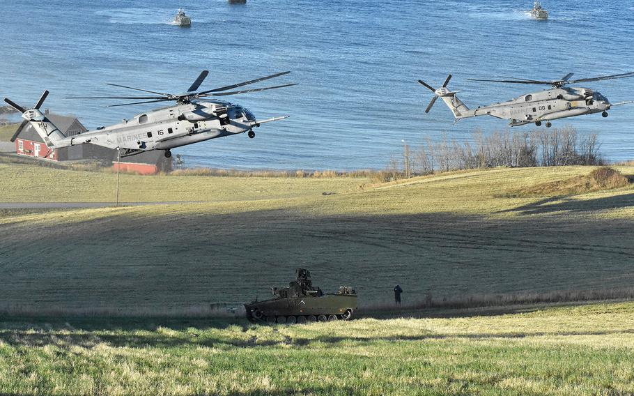 Helicopters hover over a simulated assault in a defense of a Norwegian coastal area on Oct. 30, 2018, during the NATO exercise Trident Juncture. All 29 NATO members plus Sweden and Finland participating in the largest allied war games since the Cold War. 