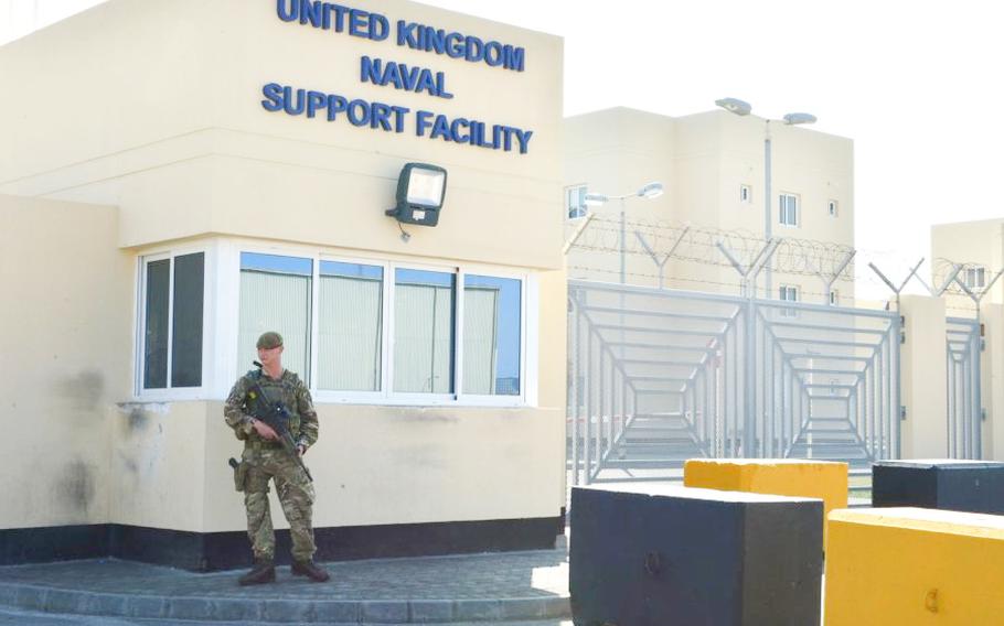 A guard stands duty at U.K. Naval Support Facility Bahrain.

