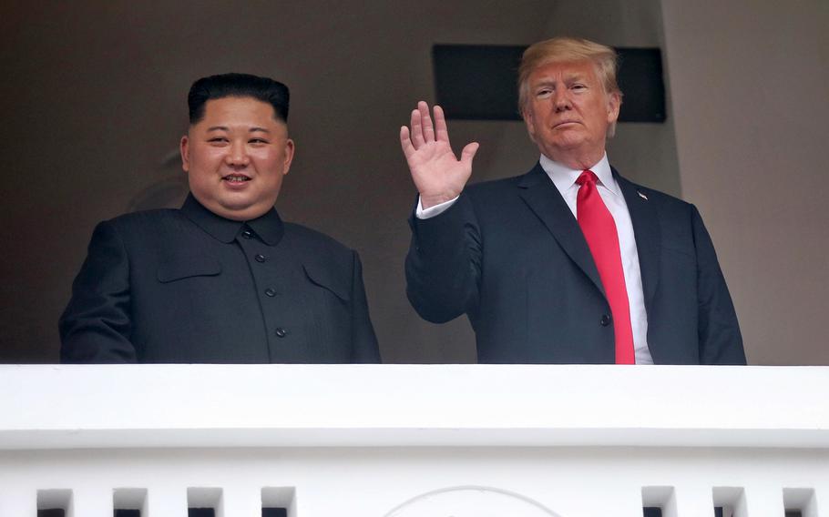President Donald Trump and North Korean leader Kim Jong Un wave to the media during their meeting in Singapore on June 12, 2018. Reports say new satellite images provide more evidence that the communist state is persisting with its nuclear weapons program despite U.S.-led diplomatic efforts to stop it.