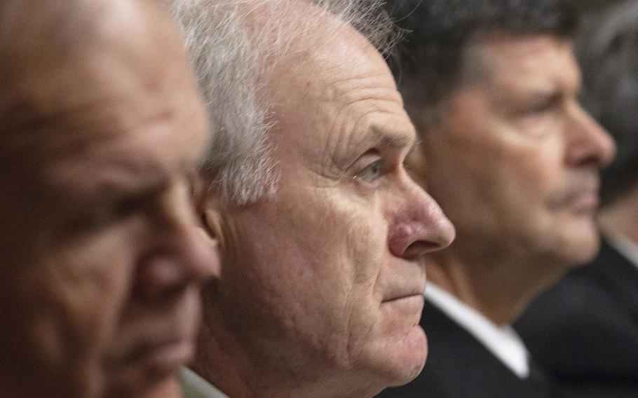 Secretary of the Navy Richard Spencer, center, listens to opening statements during a Senate Armed Services subcommittee hearing on Navy and Marine Corps readiness, Dec. 12, 2018, on Capitol Hill.