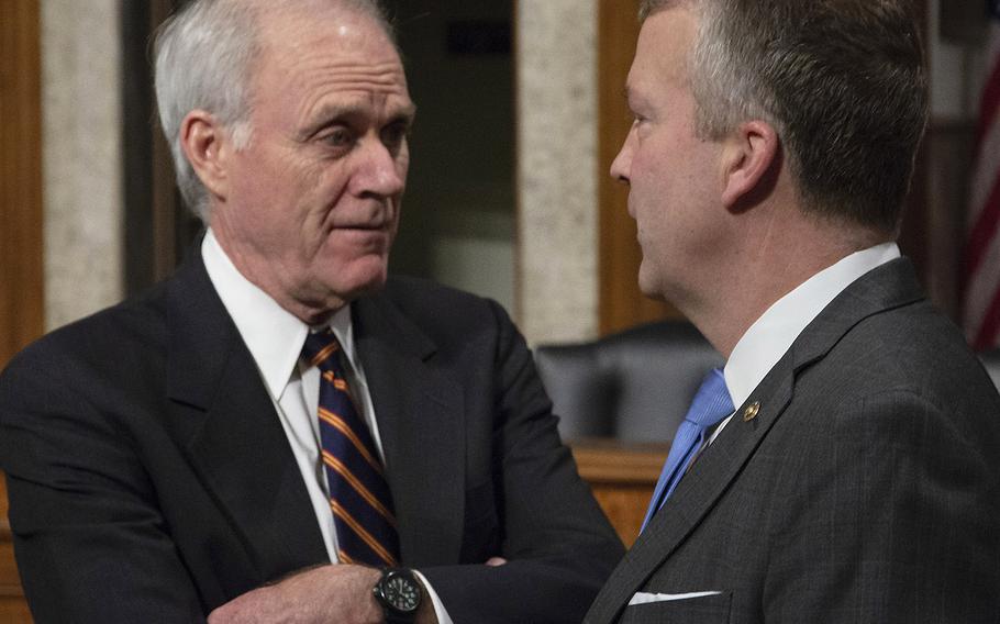 Secretary of the Navy Richard Spencer, left, talks with Sen. Dan Sullivan, R-Alaska, before a Senate Armed Services subcommittee hearing on Navy and Marine Corps readiness, Dec. 12, 2018, on Capitol Hill.