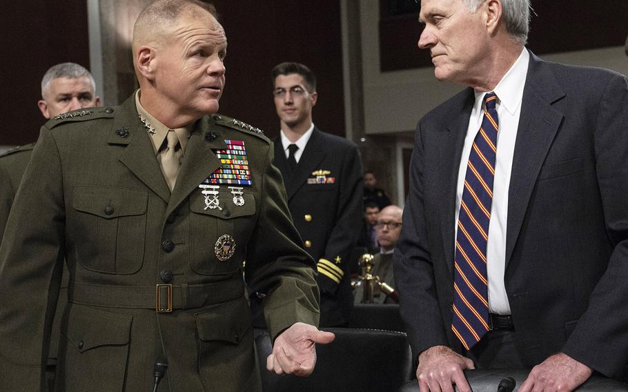 Marine Corps Commandant Gen. Robert Neller talks with Secretary of the Navy Richard Spencer before a Senate Armed Services subcommittee hearing on Navy and Marine Corps readiness, Dec. 12, 2018, on Capitol Hill.