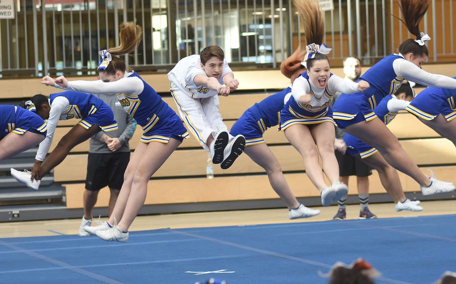 Sigonella cheer members kick their legs up in the air as part of their winning Division III routine at the DODEA-Europe cheerleading championships on Saturday, Feb. 23, 2019, in Wiesbaden, Germany.
