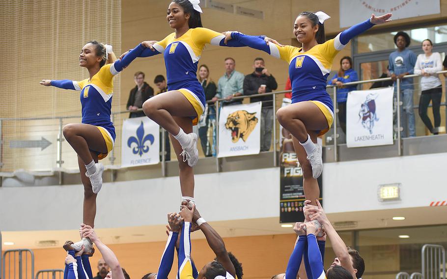 Members of Wiesbaden's cheer squadron put on a balancing act during the DODEA-Europe cheerleading championships on Saturday, Feb. 23, 2019, in Wiesbaden, Germany. The Warriors finished second in Division I.
