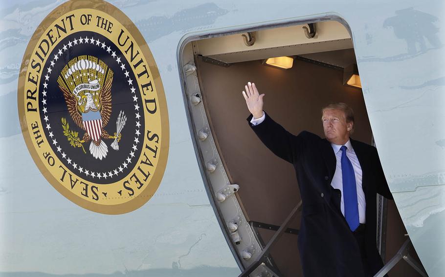 President Donald Trump waves while boarding Air Force One for a trip to Vietnam to meet with North Korean leader Kim Jong Un, Monday, Feb. 25, 2019, in Andrews Air Force Base, Md. 