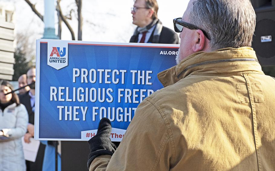 American Legion members who oppose a lawsuit concerning the Bladensburg Cross stand outside the Supreme Court, Feb. 27, 2019.