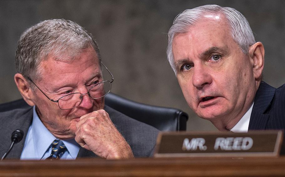 Senate Armed Services Committee Chairman Jim Inhofe, R-Okla. at left, and Ranking Member Jack Reed, D-R.I., confer with each other during a hearing on Capitol Hill in Washington on Tuesday, April 2, 2019.