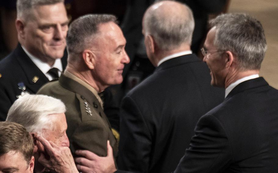NATO Secretary General Jens Stoltenberg, right, stops to greet Joint Chiefs of Staff Chairman Gen. Joseph Dunford as he arrives to address a joint session of Congress at the U.S. Capitol, April 3, 2019. At left is Army Chief of Staff Gen. Mark Milley.