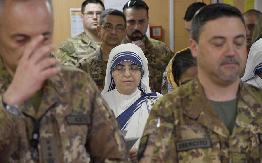 A nun doing charity work in Afghanistan attends a Catholic Easter service with coalition troops at NATO's Resolute Support headquarters in Kabul on Sunday, April 21, 2019.